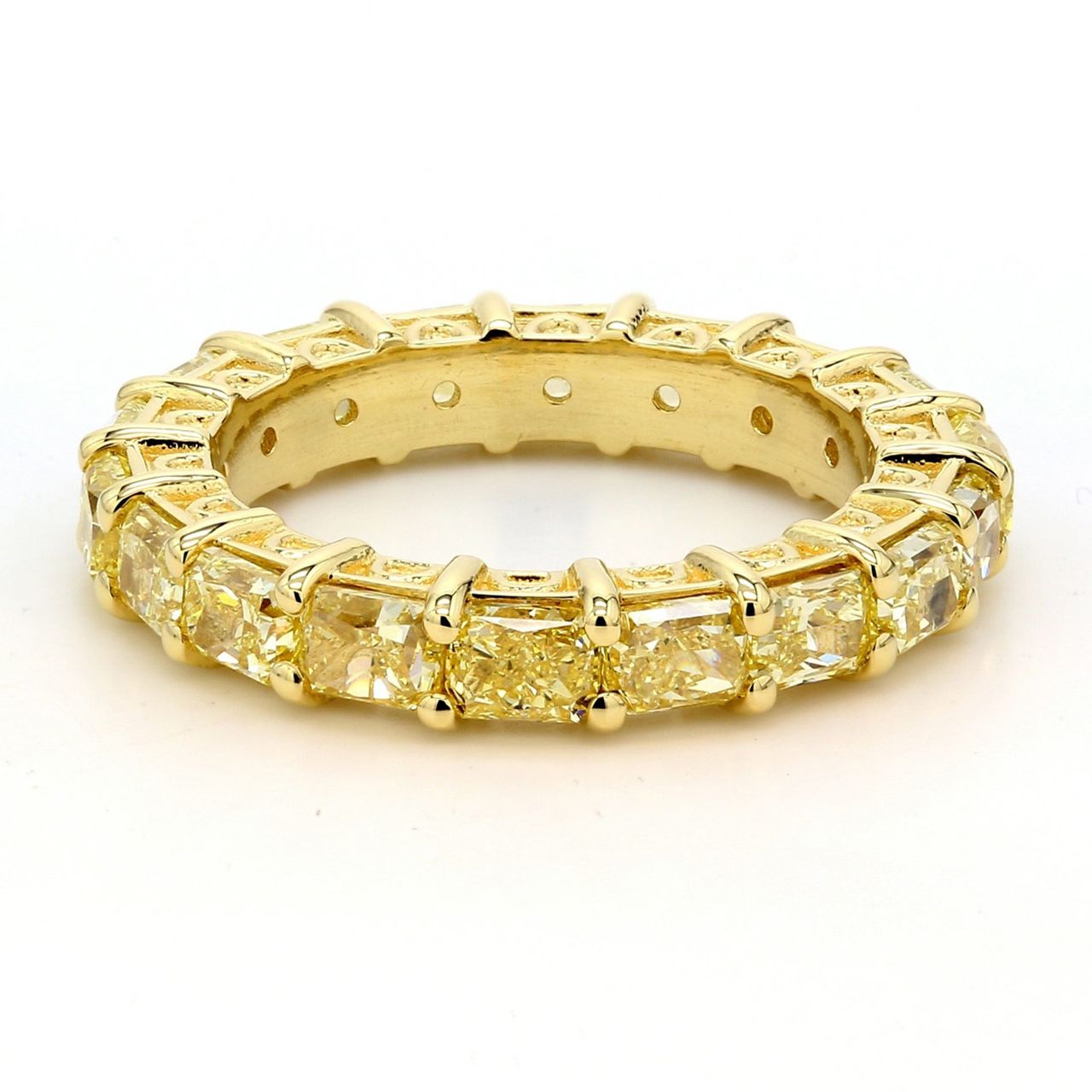Eternity band in 18K YG with 4-prong set (18) fancy yellow radiant cut diamonds.  D4.45ct.t.w.  Size 6.25