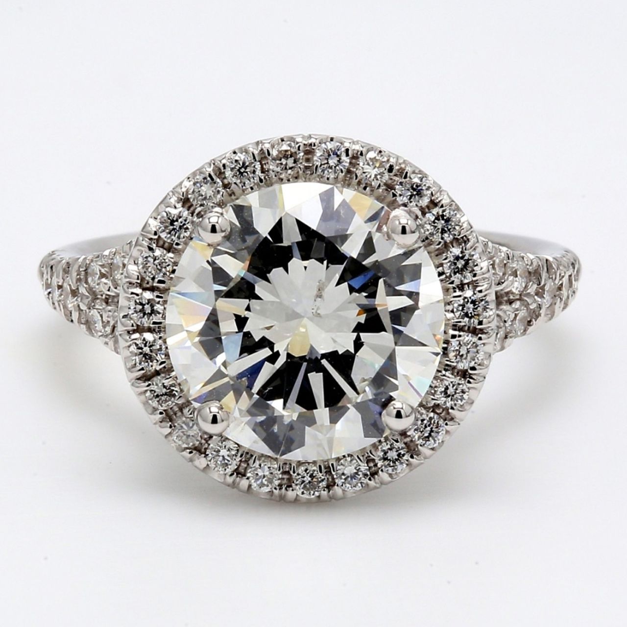 Halo split shank semi-mount in 18K WG with prong set round diamonds.  D0.58ct.t.w.