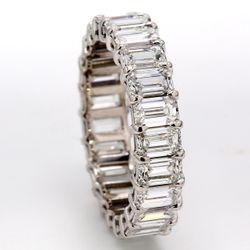 Eternity band in platinum with basket prong set (23) emerald cut diamonds.  D5.22ct.t.w.  Size 7