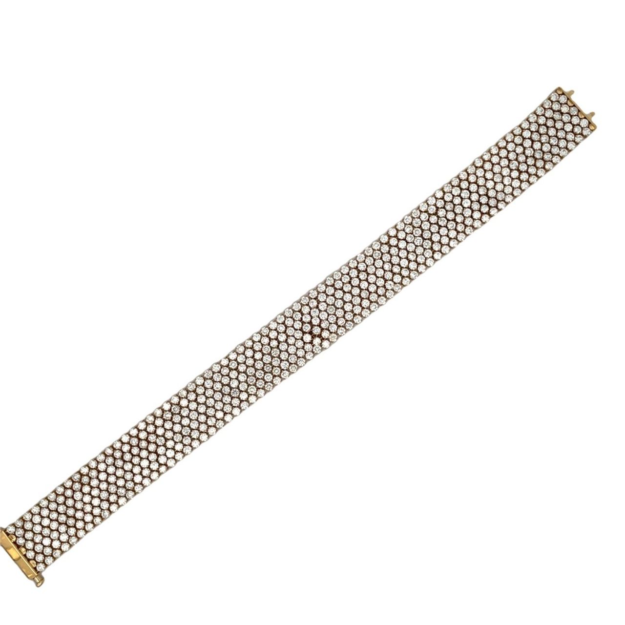 7.25' 7-row lace style bracelet in 18K YG with shared prong set round diamonds.  D21.25ct.t.w.