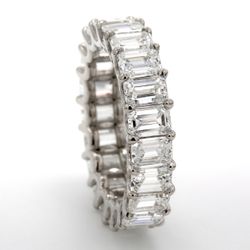 Eternity band in platinum with U-prong set (22) emerald cut diamonds.  D5.44ct.t.w.  Size 5