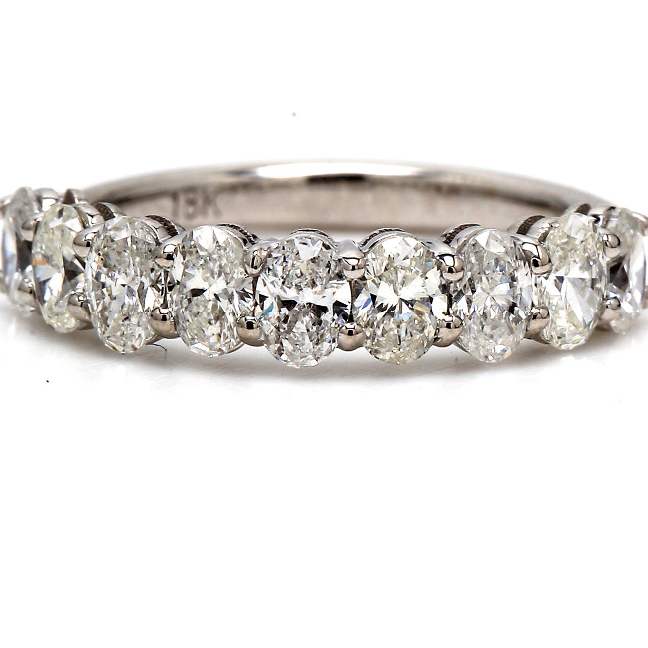 9-stone band in 18K WG with basket prong set oval cut diamonds.  D1.20ct.t.w.  Size 5