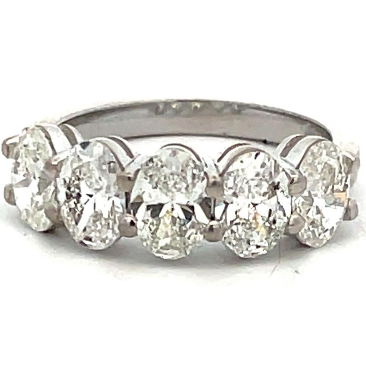 5-stone band in platinum with shared prong set  G-H/SI1-SI2 GIA certified oval cut diamonds.  D2.50ct.t.w.  Size 6