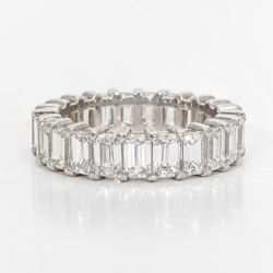Eternity band in platinum with shared prong set (23) emerald cut diamonds.  D4.61ct.t.w.  Size 6