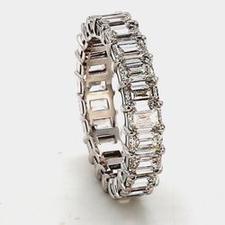 Eternity band in platinum with basket claw prong set (23) emerald cut diamonds.  D7.08ct.t.w.  Size 8.5