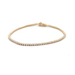 7' Tennis bracelet in yellow gold with basket prong set (103) round diamonds.  D1.12ct.t.w.