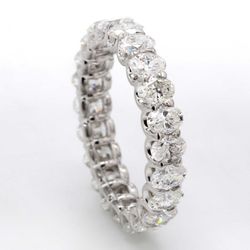 Eternity band with shared U-prong set E-F/VS (22) oval diamonds.  D2.99ct.t.w.  Size 5.5