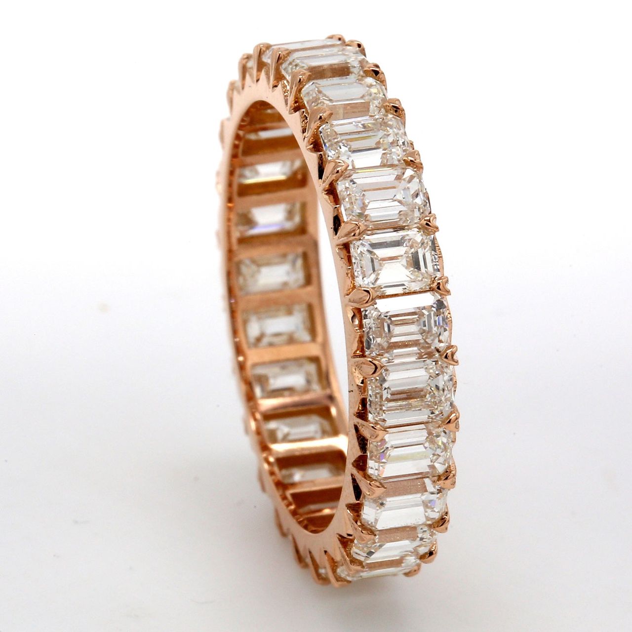 Eternity band in 18K RG with prong set (25) emerald cut diamonds.  D4.58ct.t.w.  Size 7.5