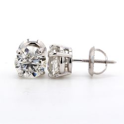 Screw back stud earrings with 4-prong set USA certified E-F/SI3 round diamonds.  D2.59ct.t.w.