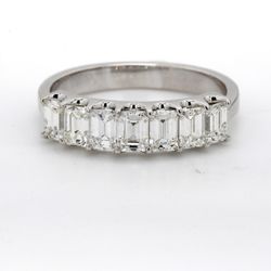 7-stone band in platinum with U-prong set emerald cut diamonds.  D1.32ct.t.w.  Size 6.75