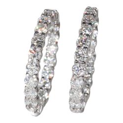 1.25' Inside out hoop earrings with shared prong set round diamonds.  D6.88ct.t.w.