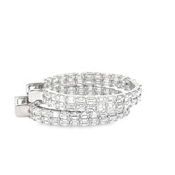 1.25' Oval shaped two-row inside out hoop earrings in 18K WG with prong set (100) emerald cut diamonds.  D8.46ct.t.w.