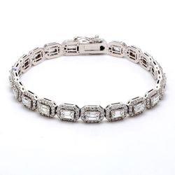 7.5' Halo tennis bracelet with prong set rounds around prong set emerald cut diamond centers.  D8.13ct.t.w.