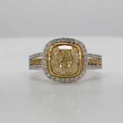 Triple shank halo ring in 18K WG with bezel set FLY/VS1 GIA certified cushion center stone and prong set white and yellow diamonds.  D3.41ct.t.w.  (Center - 3.01ct.)