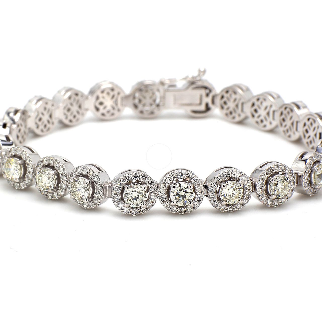 7' Halo tennis bracelet with prong set round diamonds.  D7.23ct.t.w.