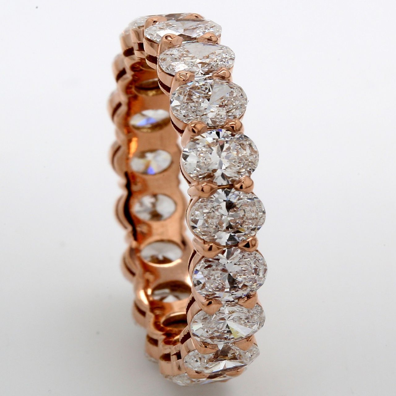Eternity band in 18K RG with basket set F/VS (19) oval cut diamonds.  D3.74ct.t.w.  Size 5.75