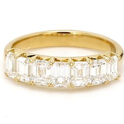 7-stone band in 18K YG with prong set emerald cut diamonds.  D1.66ct.t.w.  Size 5