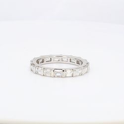 Eternity band east to west style in platinum with channel set emerald cut diamonds.  D3.21ct.t.w.  Size 8