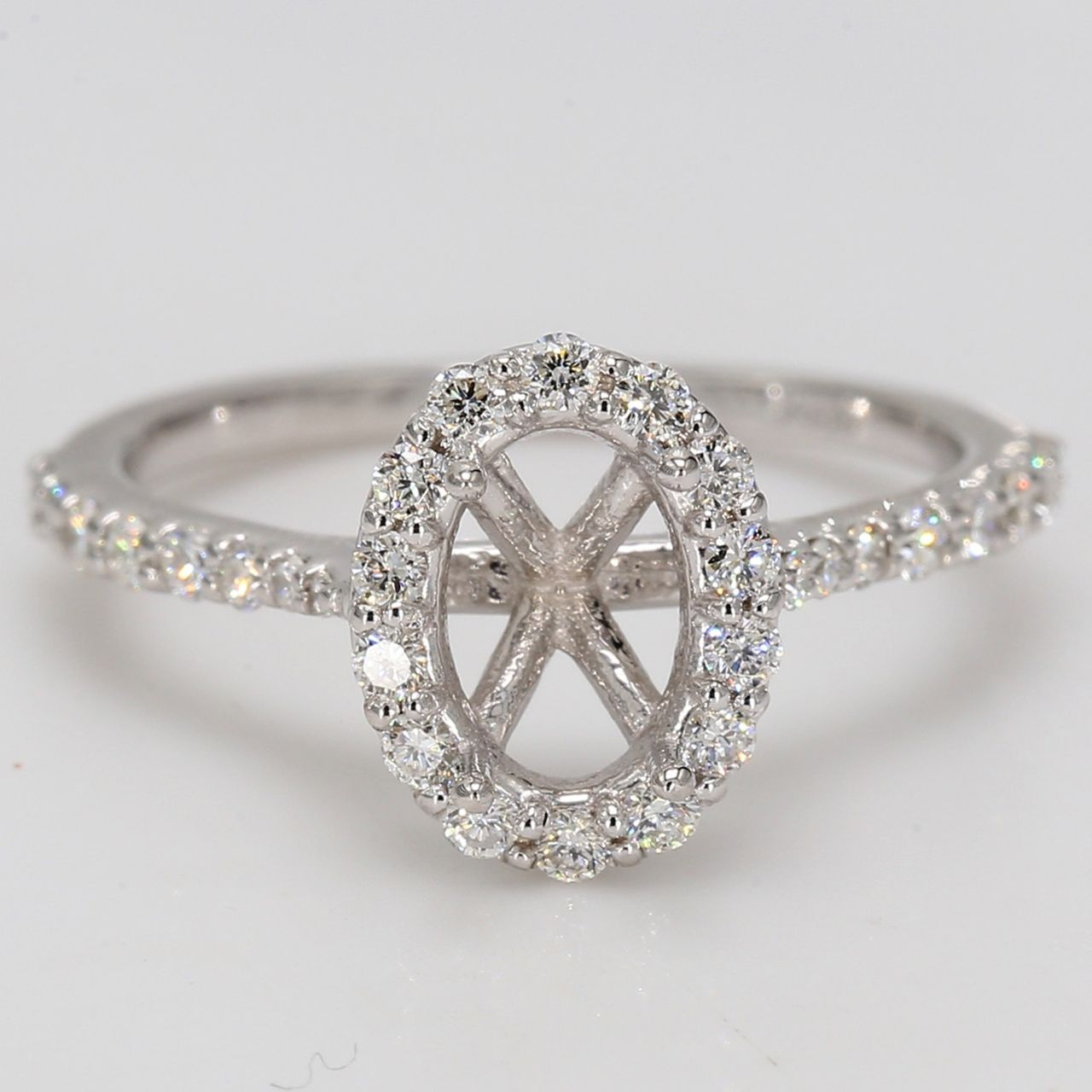 Halo semi-mount with U-prong set round diamonds.  D0.44ct.t.w.