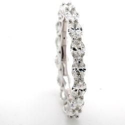 Eternity band east to west style in platinum with prong set (17) oval cut diamonds.  D2.43ct.t.w.  Size 7