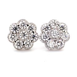 Flower design push back earrings with pave set rounds around prong set round diamonds.  D5.02ct.t.w.