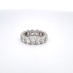 Eternity band in platinum with basket claw prong set GIA certified G-H/VS1-SI1 (15) oval cut diamonds.  D6.02ct.t.w.  Size 5.25