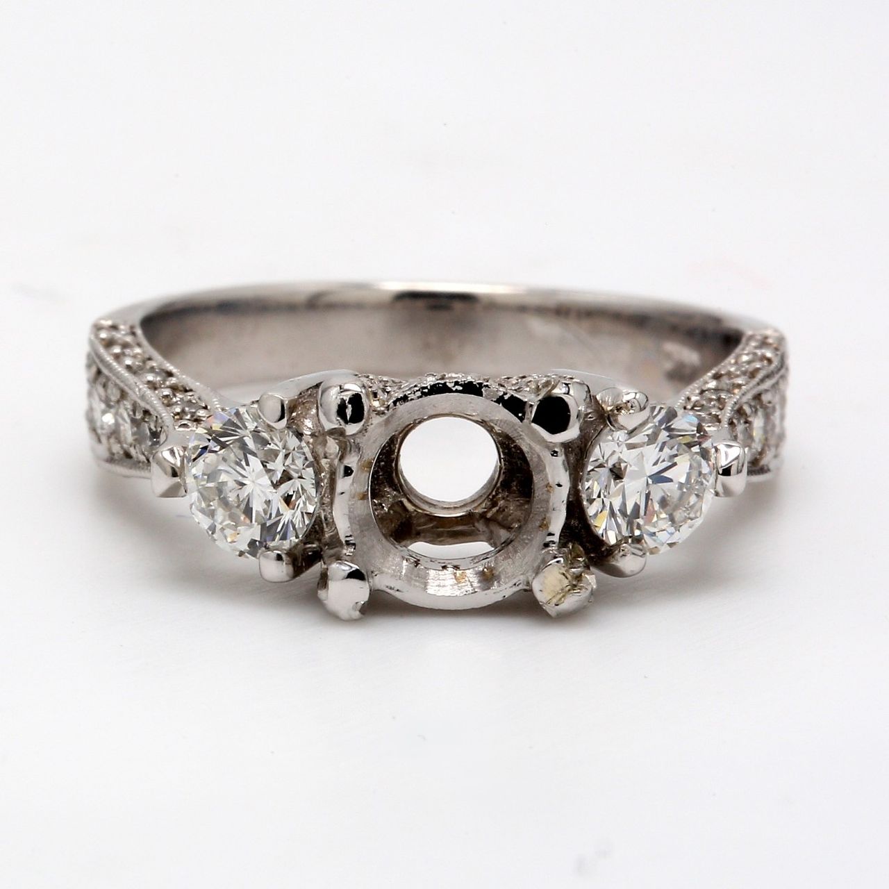 3-stone designer semi-mount with round diamonds.  D1.34ct.t.w.