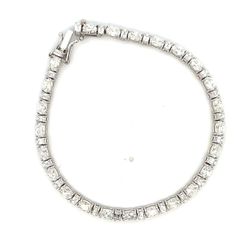 Tennis bracelet with basket prong set alternating (24) oval and (24) emerald cut diamonds.  D6.44ct.t.w.