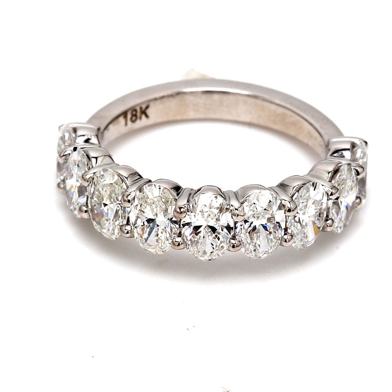 9-stone band in 18K WG with basket prong set oval cut diamonds.  D2.50ct.t.w.  Size 5.5