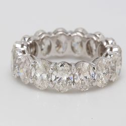 Eternity band in platinum with shared basket claw prong set GIA certified G-H/VS1-SI1 (15) oval diamonds.  D7.67ct.t.w.  Size 5.75
