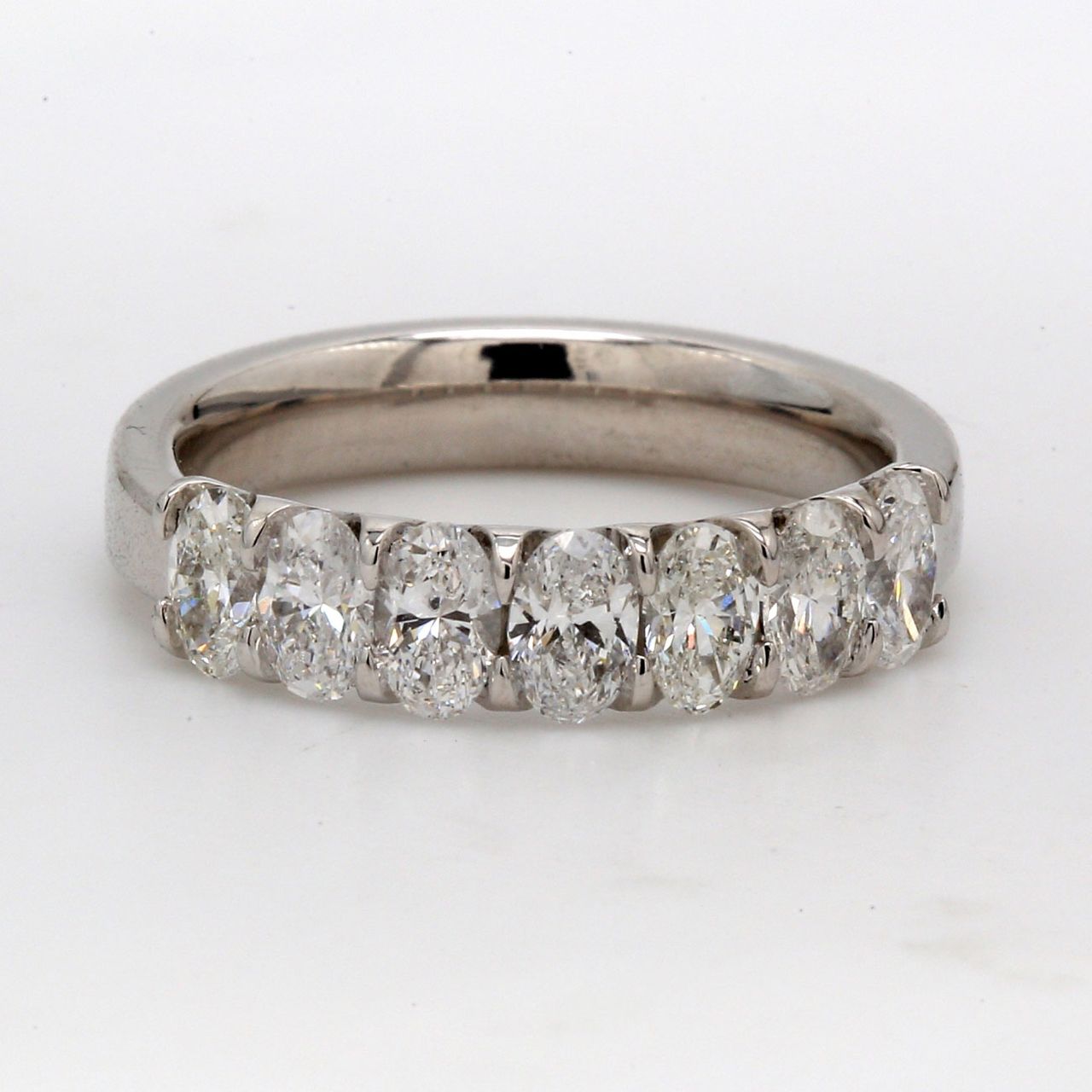 7-stone band in platinum with U-prong set oval cut diamonds.  D1.30ct.t.w.  Size 6