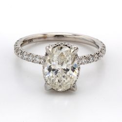 Semi-mount for oval center in 18K WG with pave set (54) round diamonds.  D0.95ct.t.w.  Size 6