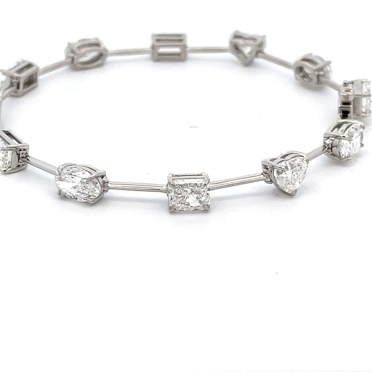 7' Multi-shape bracelet in platinum with prong set mixed shape diamonds.  D8.64ct.t.w.