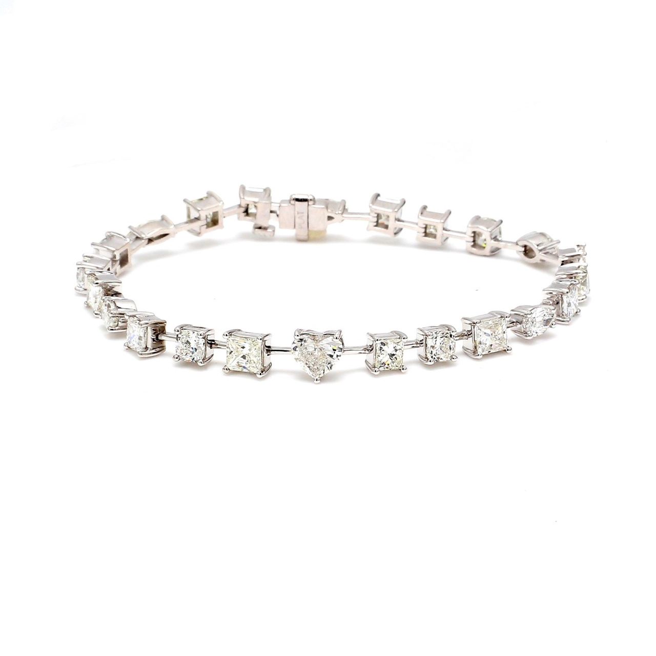 7' Tennis bracelet in platinum with alternating prong set assorted shape diamonds.  D8.63ct.t.w.