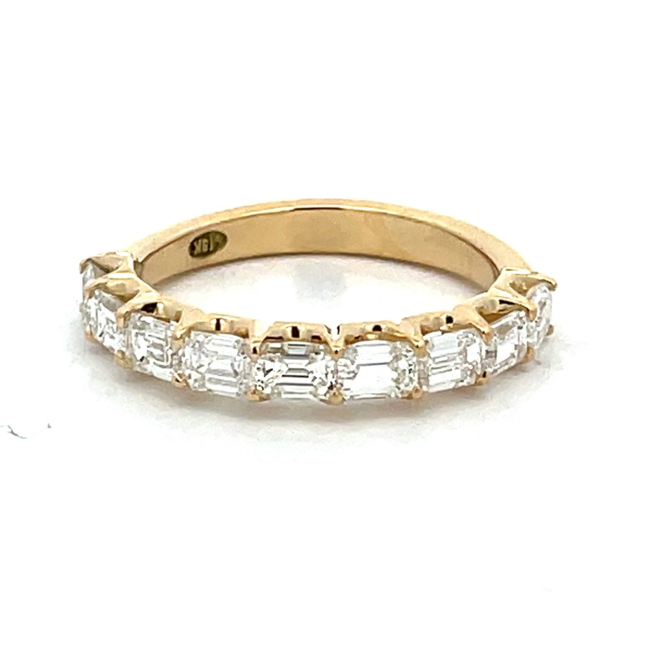 9-stone band east west style in 18K YG with prong set emerald cut diamonds.  D1.24ct.t.w.  Size 5