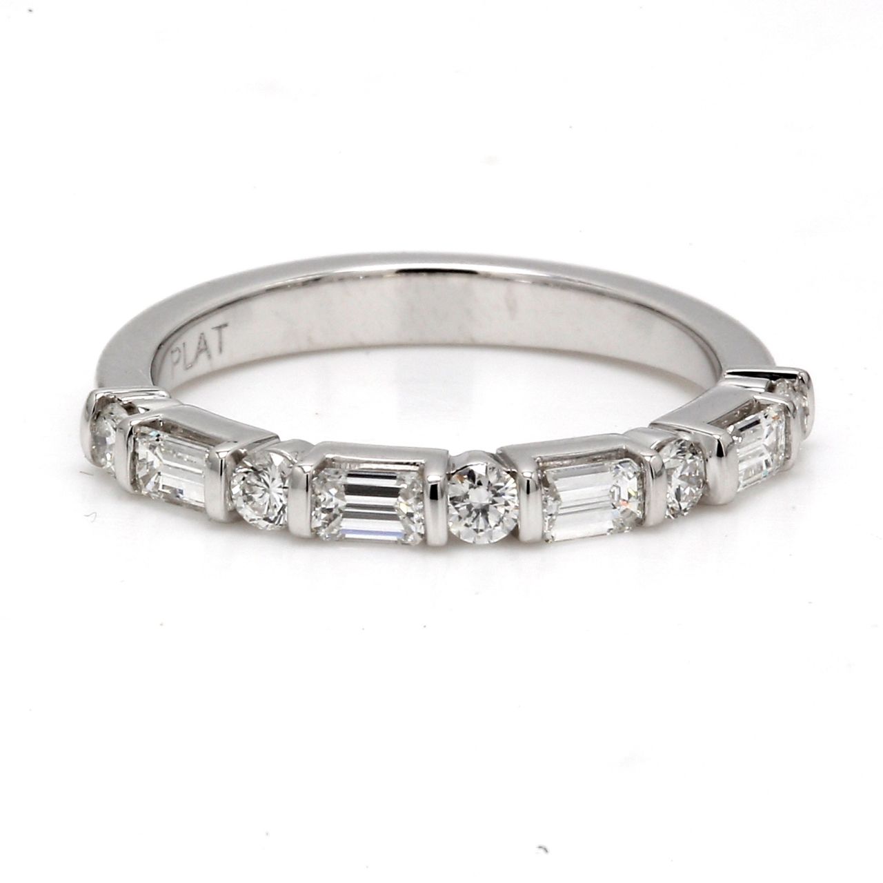 Half way band in platinum with channel set (5) rounds and basket set (4) emerald cut diamonds.  D0.58ct.t.w.  Size 7