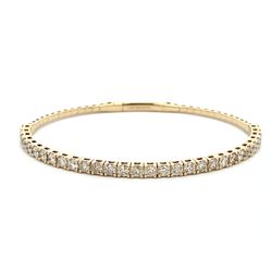 6.5' Light weight flexible oval shaped bangle in yellow gold with prong set round diamonds.  D1.85ct.t.w.