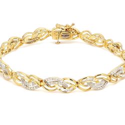 8' Bracelet 10K YG with prong set round diamonds.  D3.50ct.t.w.