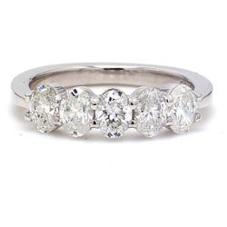 5-stone band in platinum with basket prong set oval cut diamonds.  D1.17ct.t.w.  Size 5.5