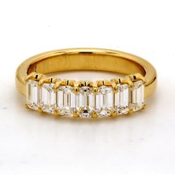 7-stone band in 18K YG with U-prong set emerald cut diamonds.  D1.32ct.t.w.  Size 6
