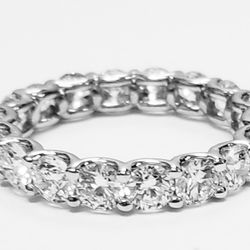 Eternity band in platinum with shared U-prong set E-F/VS round diamonds.  D3.60ct.t.w.  Size 5.5
