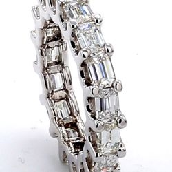 East to west style eternity band with U-prong set (17) emerald cut diamonds.  D3.26ct.t.w.  Size 5