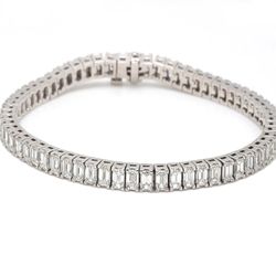 7' Tennis bracelet in platinum with 4-prong basket set emerald cut diamonds.  D8.85ct.t.w.