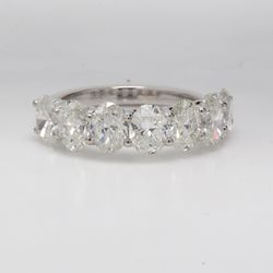 7-stone band with U-prong set GIA certified G-H /SI1-SI2 oval diamonds.  D3.51ct.t.w.  Size 6.75