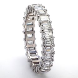 Eternity band in platinum with prong set (26) emerald cut diamonds.  D3.52ct.t.w.  Size 7.25