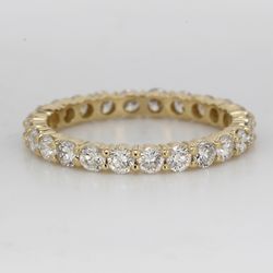 Eternity band in 14K YG with shared prong set round diamonds.  D1.09ct.t.w.  Size 4.75
