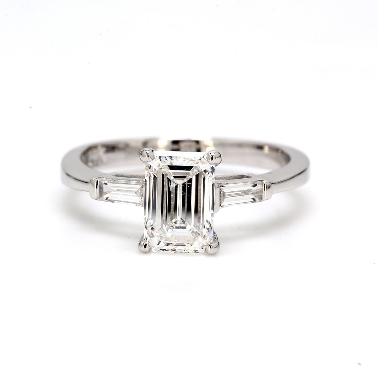 3-stone semi-mount with channel set baguette diamond sides.  D0.20ct.t.w.  Size 6.5
