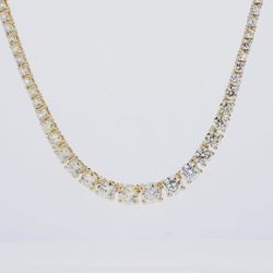 16' Half way graduated tennis necklace in 14K YG with 4-prong set round diamonds.  D5.56ct.t.w.