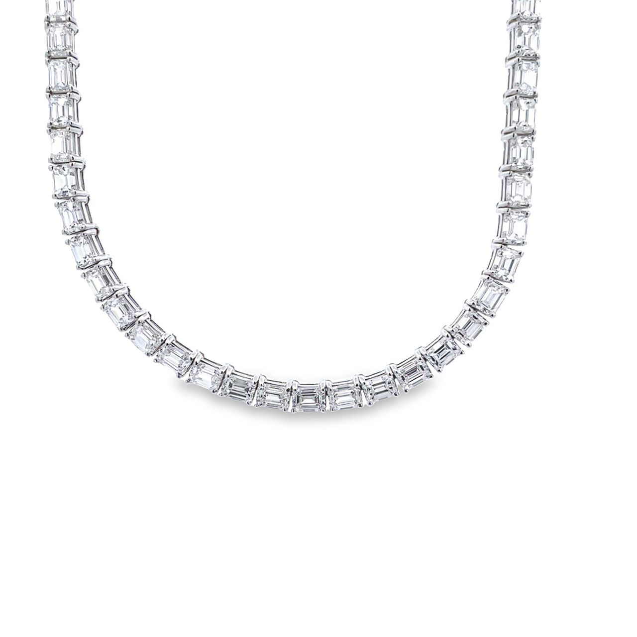 17.25' Tennis necklace east to west style in 18K WG with 4-prong basket set emerald cut diamonds.  D25.70ct.t.w.